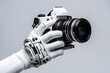 Photos created by artificial intelligence concept with white android hands holding camera