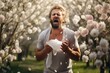 Man sneeze in Spring cherry blossom woods due to pollen allergy.