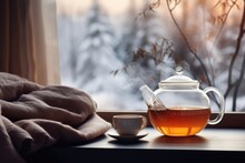Window With Tea Pot Cup And Beautiful Winter Scene. Winter Seasonal Concept.