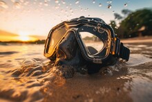 Close-up View Of A Snorkel Mask With Sunset Sea Water At Sand Beach. Summer Tropical Vacation Concept.
