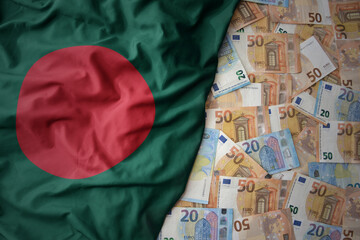 Wall Mural - colorful waving national flag of bangladesh on a euro money background. finance concept