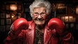 Starsza kobieta w rękawicach bokserskich gotowa do walki. 