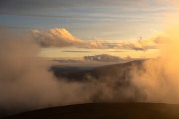 Wall Mural - Sunset with fog in autumn mountains. Landscape photography. Nature background