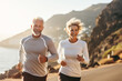© Georgii - Adult Caucasian couple in sportswear jogging along a picturesque seashore. Cheerful mature athletic man and woman smiling while running in a beautiful fresh morning. Active lifestyle for all ages.