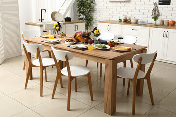 Sticker - Festive dining table with tasty food for Thanksgiving Day in kitchen