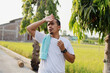 © ArvStd - Exhausted Asian man fighting the heat wave while running on the street