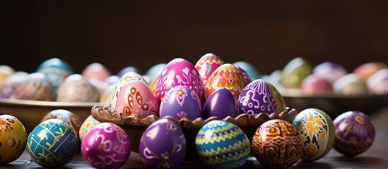 During the Orthodox Easter holiday the beautifully decorated table showcased a composition of vibrant brightly colored Easter eggs carefully hand painted in shades of lilac creating a stunn