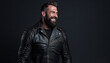 man in a leather biker suit smiling