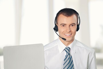 Sticker - Technical support worker with a headset in modern office.