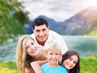 Wall Mural - Happy young cute family with child having fun