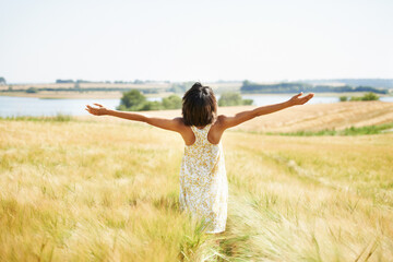 Poster - Back, freedom and woman with open arms at field in the countryside outdoor in summer mockup. Rear view, person in nature and carefree at farm, grass and enjoy fresh air on vacation, holiday or travel