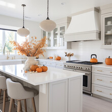 Kitchen Interior ,White Modern Kitchen Decorated For Fall With Orange Pumpkins And Leaves