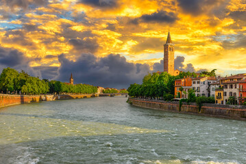 Wall Mural - Embankment of Adige river in Verona, Italy. Sunset cityscape of Verona. Architecture and landmark of Verona