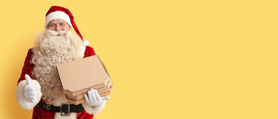 Sticker - Santa Claus holding boxes with tasty pizza and showing thumb-up on yellow background with space for text