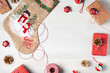 Preparing for Christmas - presents and decorations on a white wooden table. Mockup for advertisements and Christmas cards