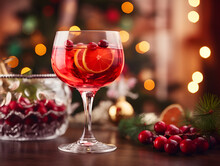 Delicious Cranberry Cocktail With Ice On Wooden Dinner Table With Blurred Lights Background 