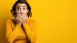 © PaulShlykov - Woman with wow face holding hands near cheeks. Sale or discount advertising poster with surprised female. Yellow background