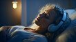 A Woman Wearing Headphones Sleeping on a Bed