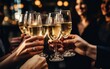 © piai - A group of friends clink glasses with champagne