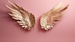 golden angel wings isolated  on a pink background. gold wings.