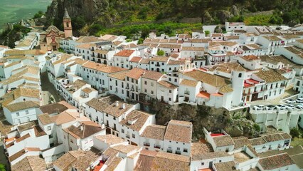 Canvas Print - Zahara de la Sierra, Andalusia. Aerial view of whitewashed houses sporting rust-tiled roofs and wrought-iron window bars