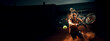 female tennis player hitting the ball with his racket on a tennis court with blurred background