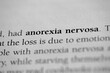 Anorexia nervosa, Psychological eating disorder term printed in black on white paper 