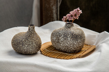 Wall Mural - Dried flowers in Handmade Double Ceramic Vases on table. Home decor, Space for text.