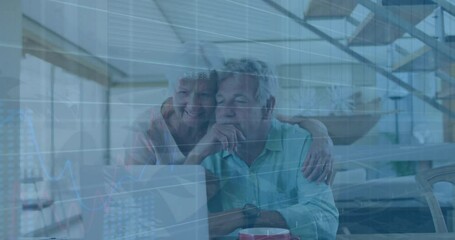 Canvas Print - Animation of graphs over senior caucasian couple watching videos on laptop at home