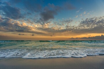 Wall Mural - Sun setting over the horizon of an ocean expanse, Destin, Florida