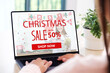 © mangpor2004 - Christmas online sale, Woman using laptop computer for shopping online discount store in Christmas season, digital marketing, e commerce