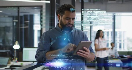 Animation of computer language over smiling caucasian businessman using tablet in office