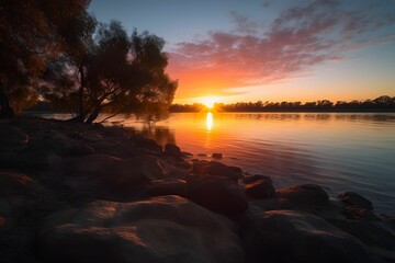 AI generated illustration of A vibrant orange and pink sunset is illuminated over a tranquil water