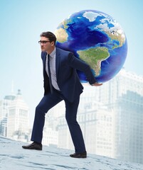 Wall Mural - Businessman carrying Earth on his shoulders