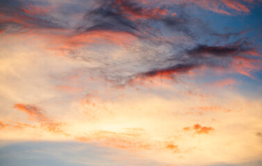Wall Mural - Cloudscape, Colored Clouds at Sunset near the Ocean on a Blue Sky