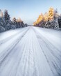 Scenic winter landscape featuring a snow and ice covered road winding amongst towering trees