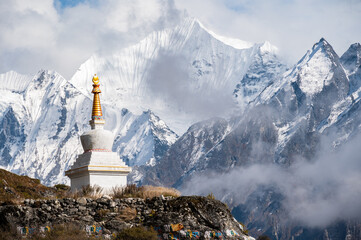 Wall Mural - Tibetan Buddhist stupa on the way to Kyangjin Kharka village in Langtang National park in Nepal.