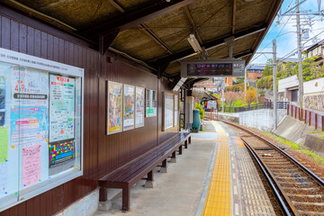 Canvas Print - Kyoto, Japan - March 31 2023: Keifuku Tram is operated by Keifuku Electric Railroad. It consists of two tram lines and it's one of the best cherry blossom spots in the west of Kyoto city