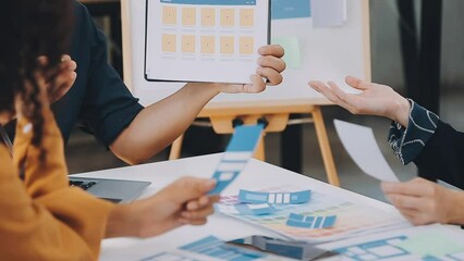 Team of Creative Web Graphic Designer planning, drawing website ux app for mobile phone application and development template layout, process to developing prototype wireframe, User experience concept.