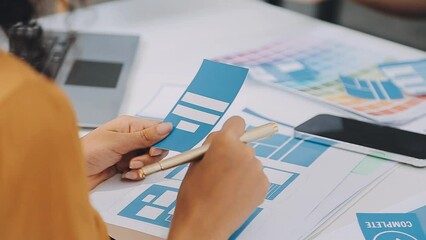 Team of Creative Web Graphic Designer planning, drawing website ux app for mobile phone application and development template layout, process to developing prototype wireframe, User experience concept.