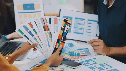Team of Creative Web Graphic Designer planning, drawing website ux app for mobile phone application and development template layout, process to developing prototype wireframe, User experience concept.