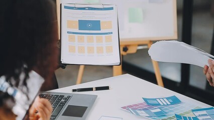 Team of Creative Web Graphic Designer planning, drawing website ux app for mobile phone application and development template layout, process to developing prototype wireframe, User experience concept.