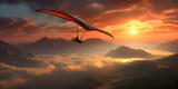 Hang gliding in sunset mountain clouds