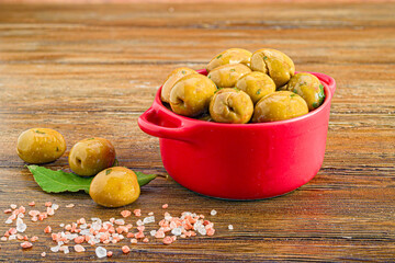 Seasoned Olives in a Saucepan. A Delicious Detail