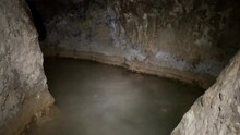 Visitor Walked In Water At Underground Flooded Siloam Tunnel In Jerusalem, Israel