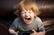 © sam - portrait of an upset child playing video game having a tantrum on sofa