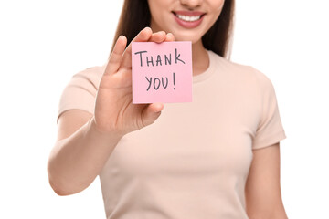 Wall Mural - Woman holding paper note with phrase Thank You on white background, closeup