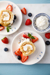 Wall Mural - Homemade Swiss roll with whipped cream and berries