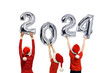 Number 2024 of shiny balloons. Numbers in the hands of people in red hats. Isolate on white background.