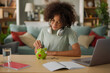 © Stockphotodirectors - Teenage boy putting coins in piggy bank- money saving concept
